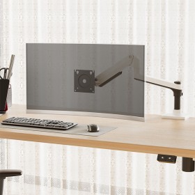 Adjustable pole-mounted desktop monitor stand arm